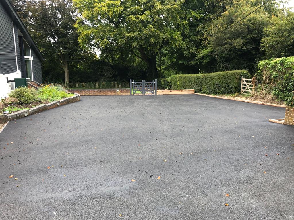 This is a photo of a bitumen driveway which is in the process of being installed by Harrisville Asphalt & Bitumen Surfacing