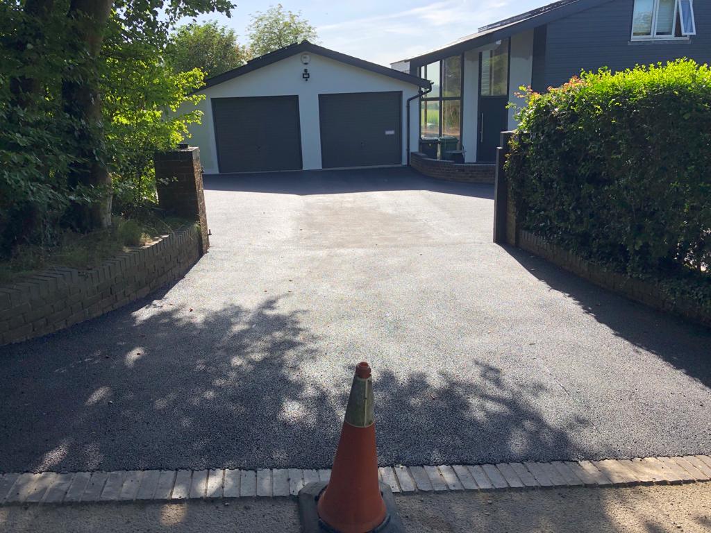 This is a photo of a bitumen driveway which is in the process of being installed by Harrisville Asphalt & Bitumen Surfacing